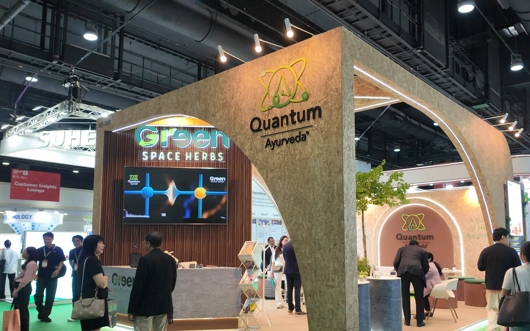 The Greenspace Herbs and Quantum Ayurveda booth at Vitafoods Asia 2026, the Greenspace Herbs sign above the screen
