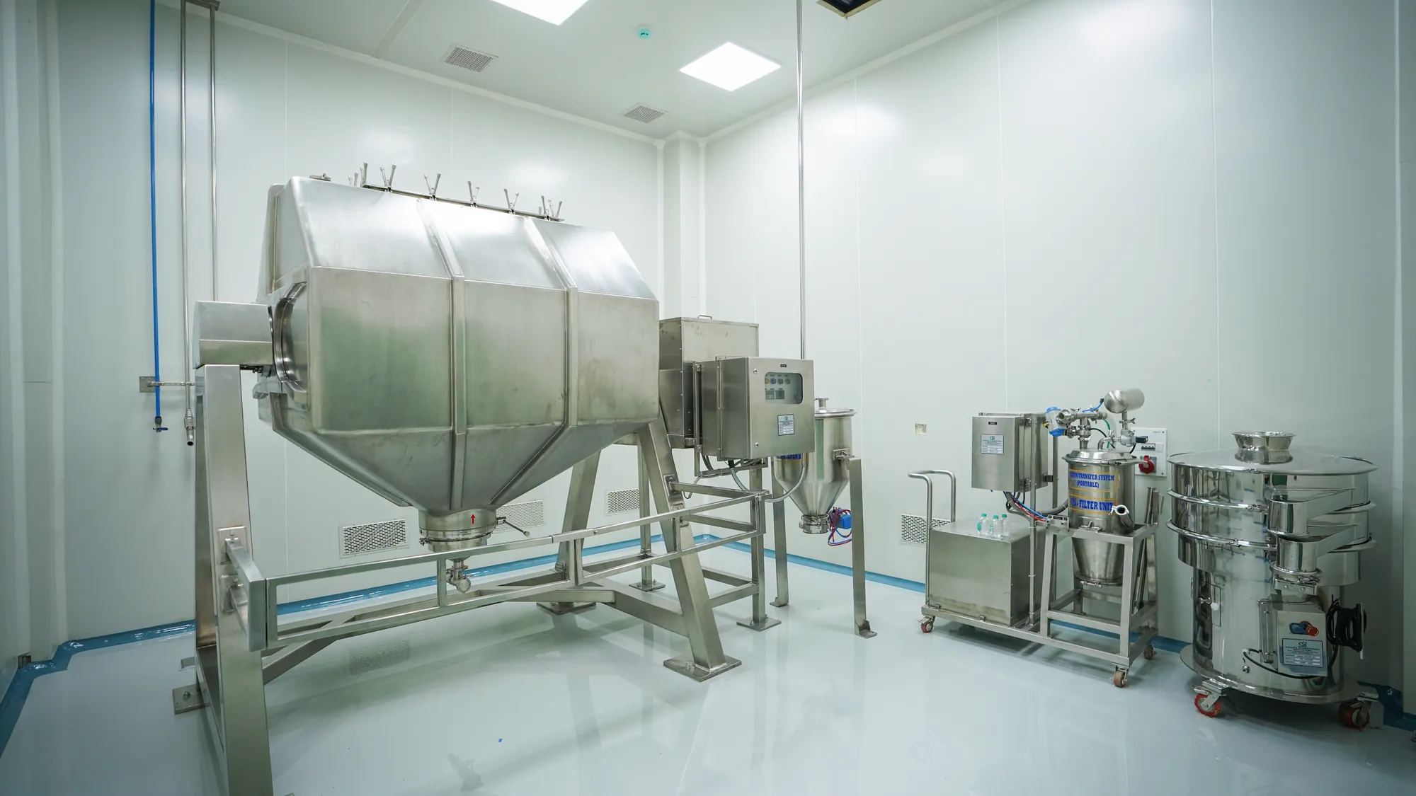 A double-cone blender, mill and sifter in a cleanroom