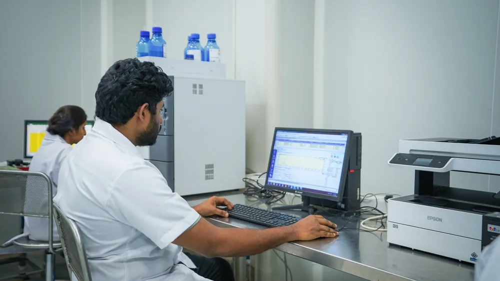 An analyst reviewing a chromatogram on the instrument workstation