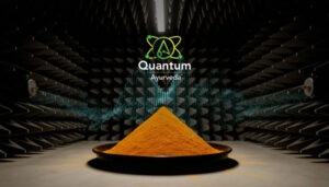 Pile of orange powder on a black plate in a soundproof studio, with Quantum Ayurveda branding above.